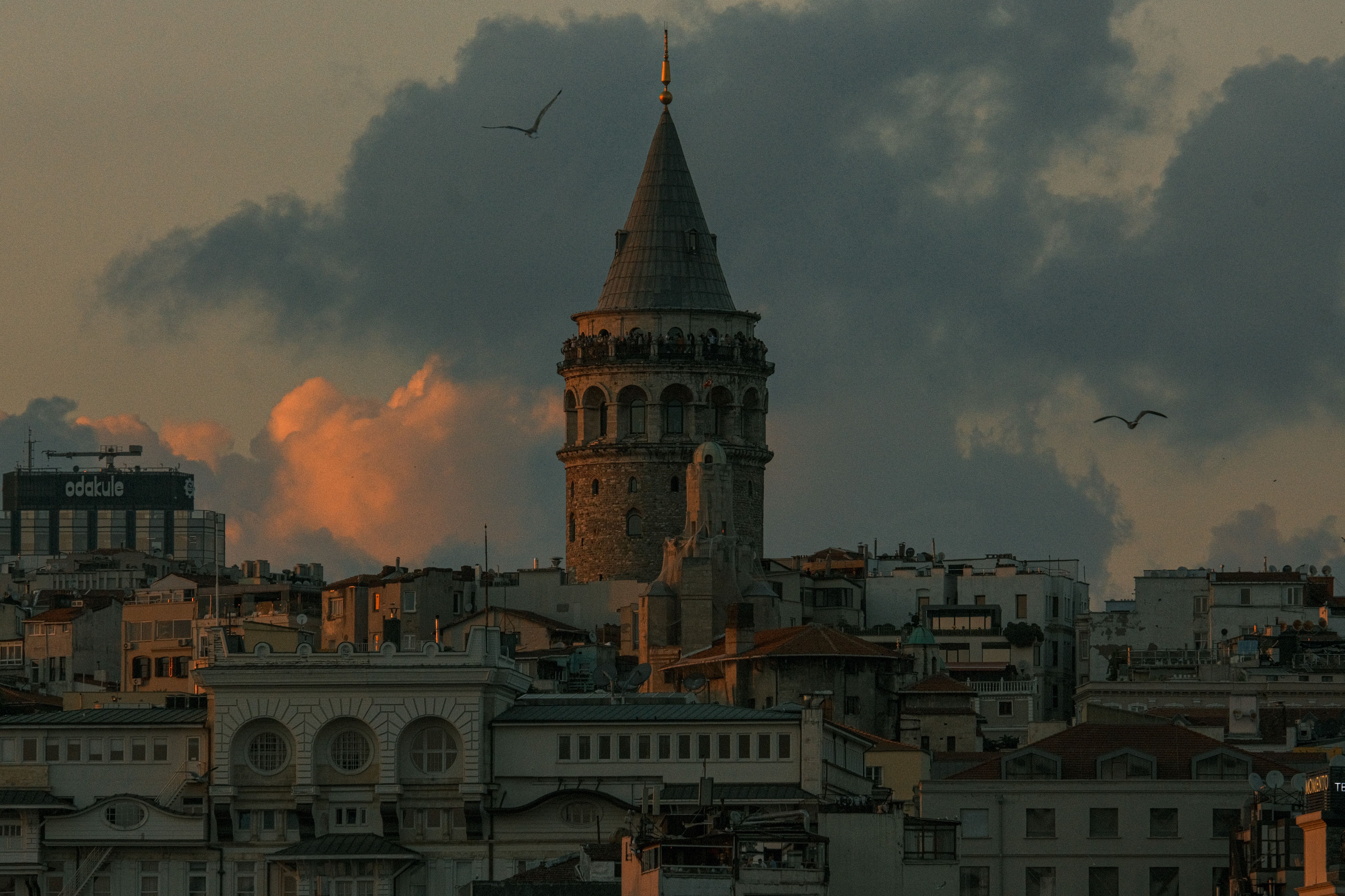 City Buildings under a Cloudy Sky · Free Stock Photo