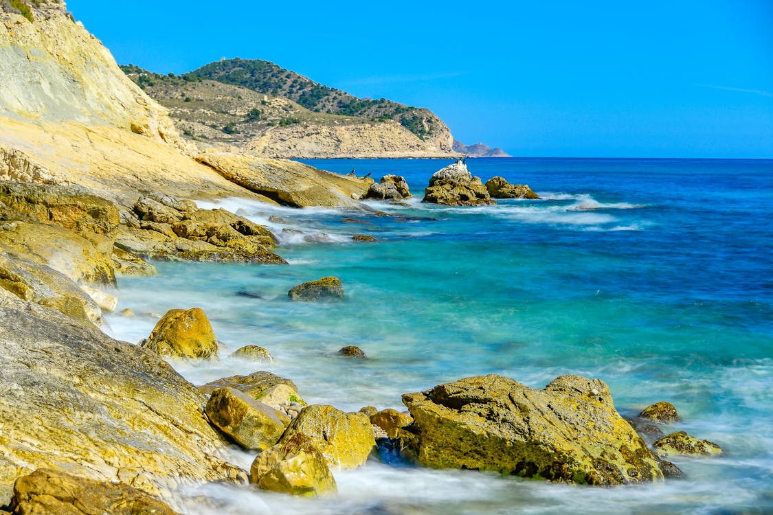 20 Top Honeymoon Destinations on Budget That Won't Break the Bank 4 Free Waves Crashing on Rocks Stock Photo