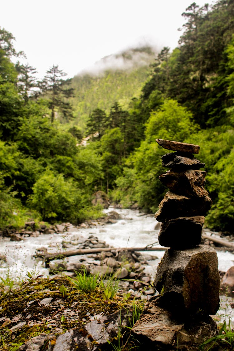 Stacked Of Rocks On A Shallow River