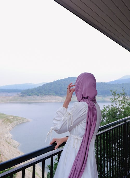 Back View of a Woman with a Purple Hijab