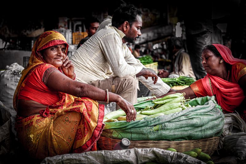 Fresh vegetables being handled at market