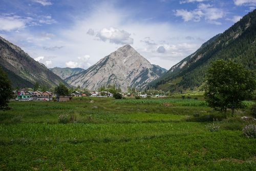Free Picturesque view of Habba Khatoon mountain and lush green fields in Gurez, Jammu and Kashmir. Stock Photo