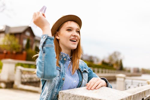 Free Woman Throwing Paper Airplane Stock Photo