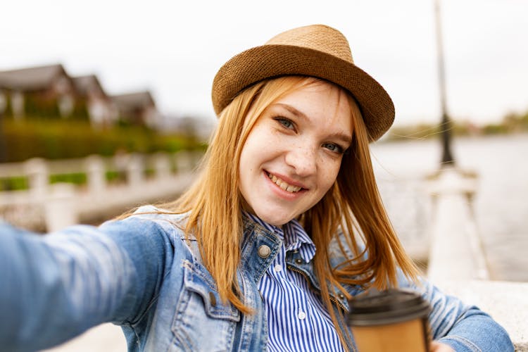 Woman Taking Selfie While Smiling