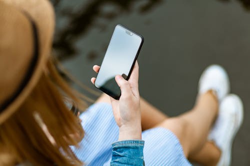 Free Person Holding Smartphone White Sitting Stock Photo
