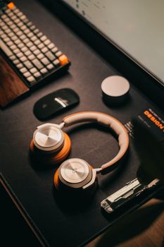 Stylish desk setup featuring headphones and tech accessories, perfect for a modern office.. stylish, desk, setup