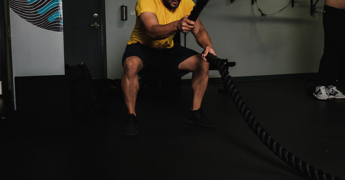 Using Rope As Exercise A Man using a Rope while Doing an Exercise · Free Stock Photo