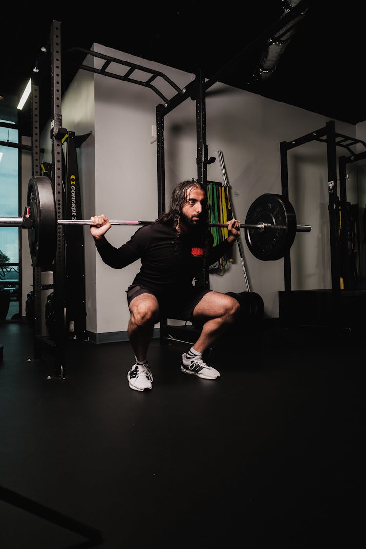 A Man Working Out At The Gym