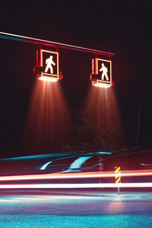 Lights of a Car Speeding Through a Crosswalk