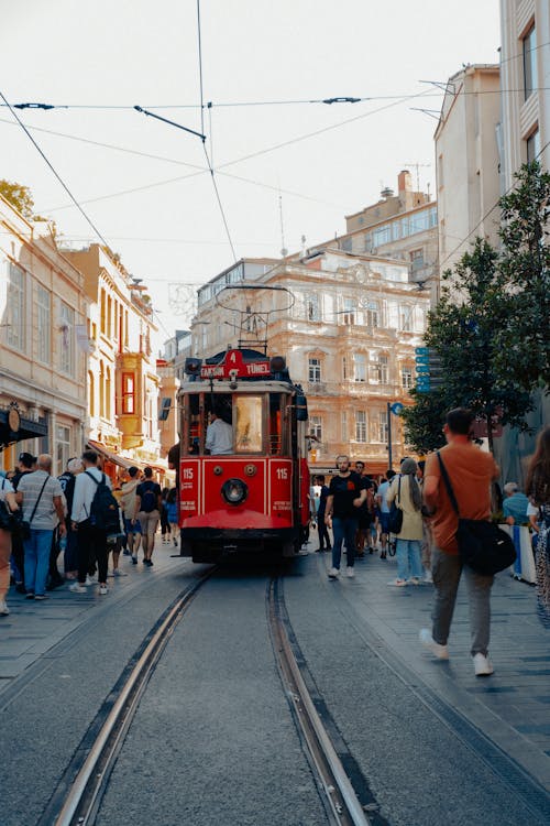 People Walking near a Tram