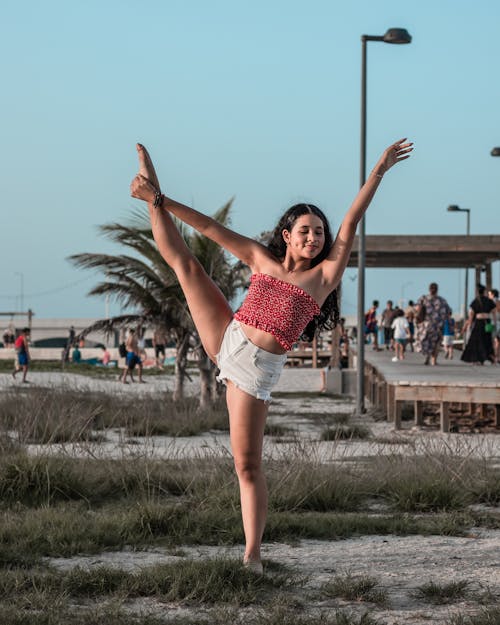 Photo of a Woman in White Shorts Dancing