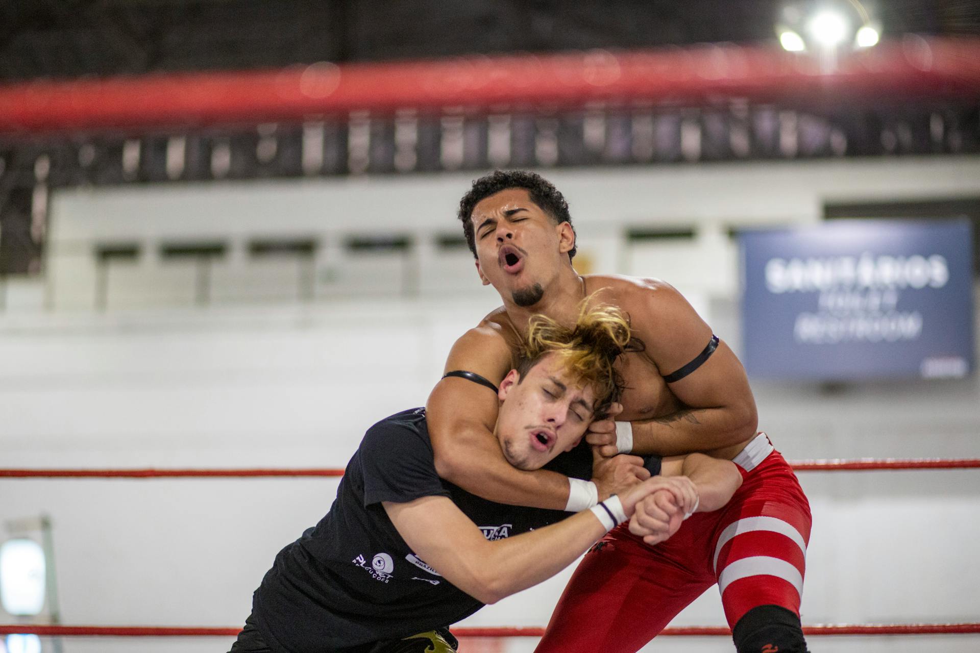 Men Fighting in Ring