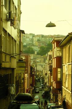 Vibrant view of a bustling street in Istanbul with colorful buildings and cars.