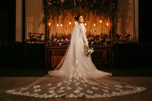 Photo of a Bride Holding a Bridal Bouquet
