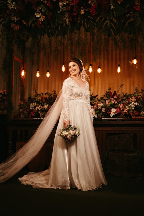 Free Bride Holding Bouquet of Flowers Stock Photo