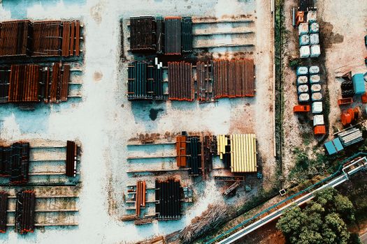 Aerial photo of an industrial area with metal beams, showcasing organization and structure.