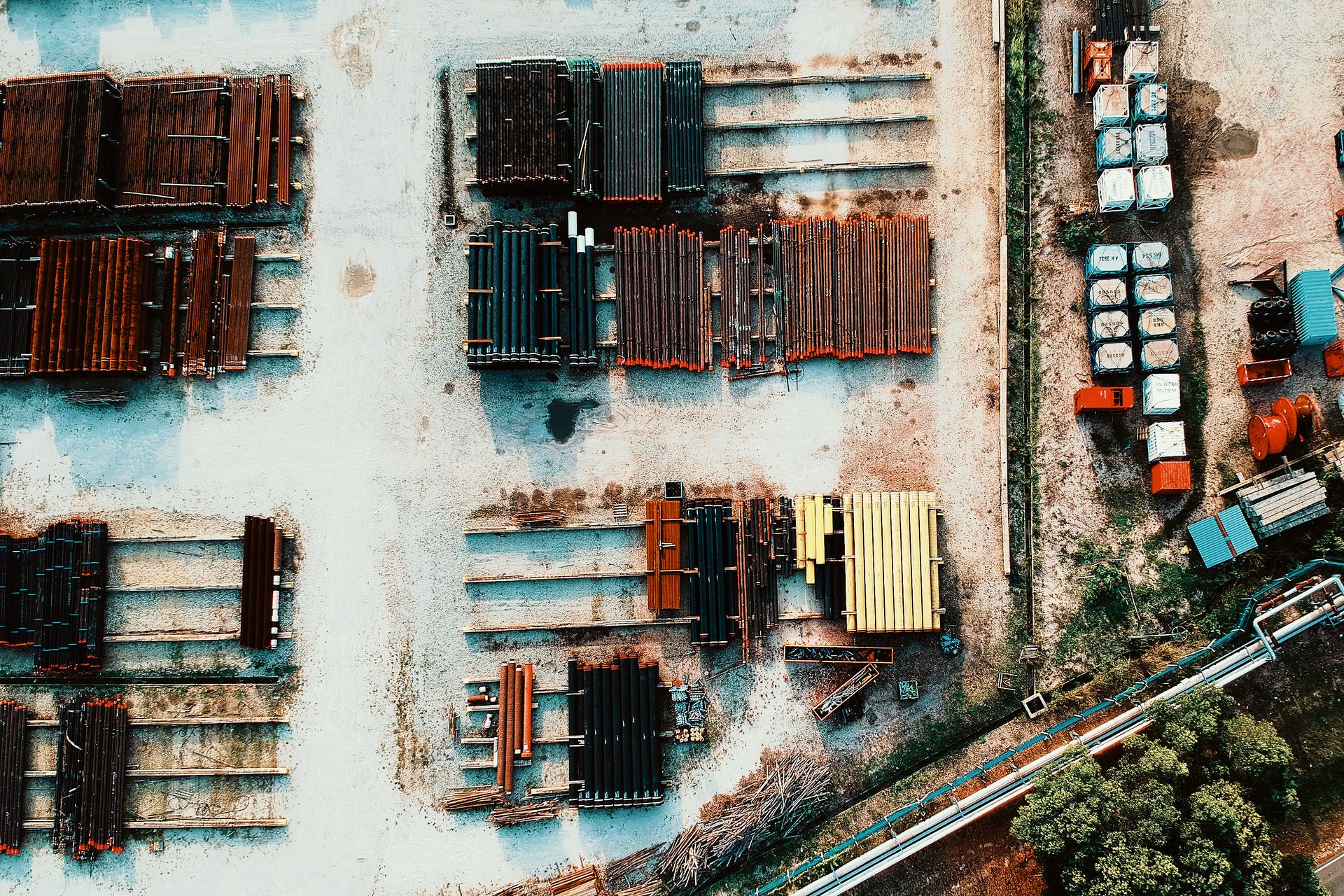 Aerial photo of an industrial area with metal beams, showcasing organization and structure.