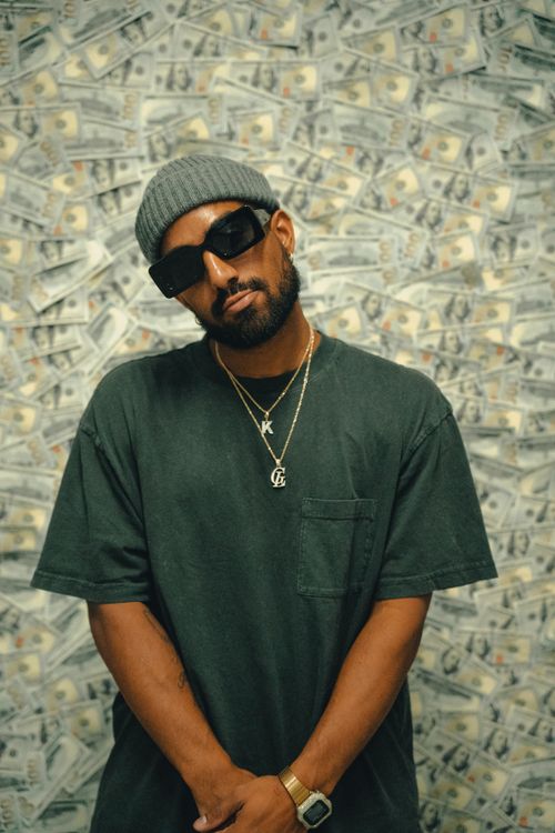 Dollar Sa Rapper Portrait of Rapper on Dollar Wall Background · Free Stock Photo