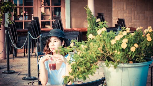 Woman Drinking Red Liquid