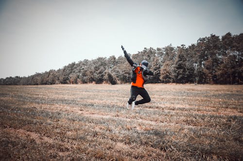 Free Person Jumping over Grass Stock Photo