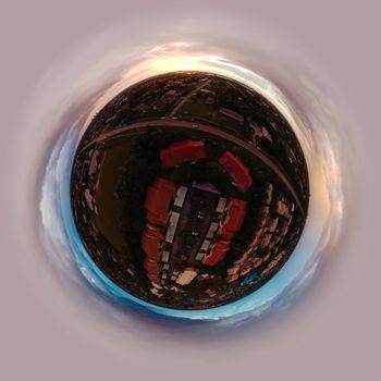 360 aerial tiny planet view capturing a vibrant sunset over Bonita Springs, Florida.
