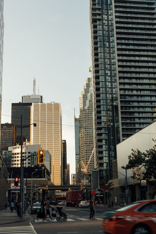 Free Urban scene in downtown with pedestrians, skyscrapers, and vehicles at a busy intersection. Stock Photo