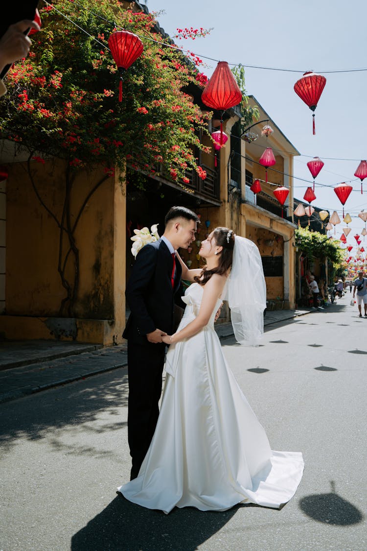 Man And Woman Standing Face To Face On Street 