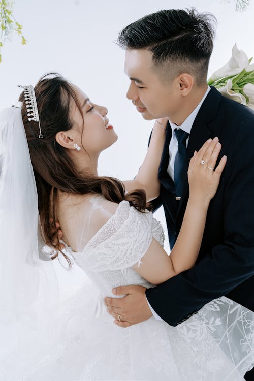 Photo of a Groom and a Bride Face to Face