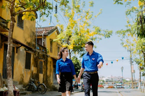 A Couple Walking while Smiling