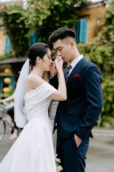 A beautiful couple sharing an intimate moment during their outdoor wedding ceremony.