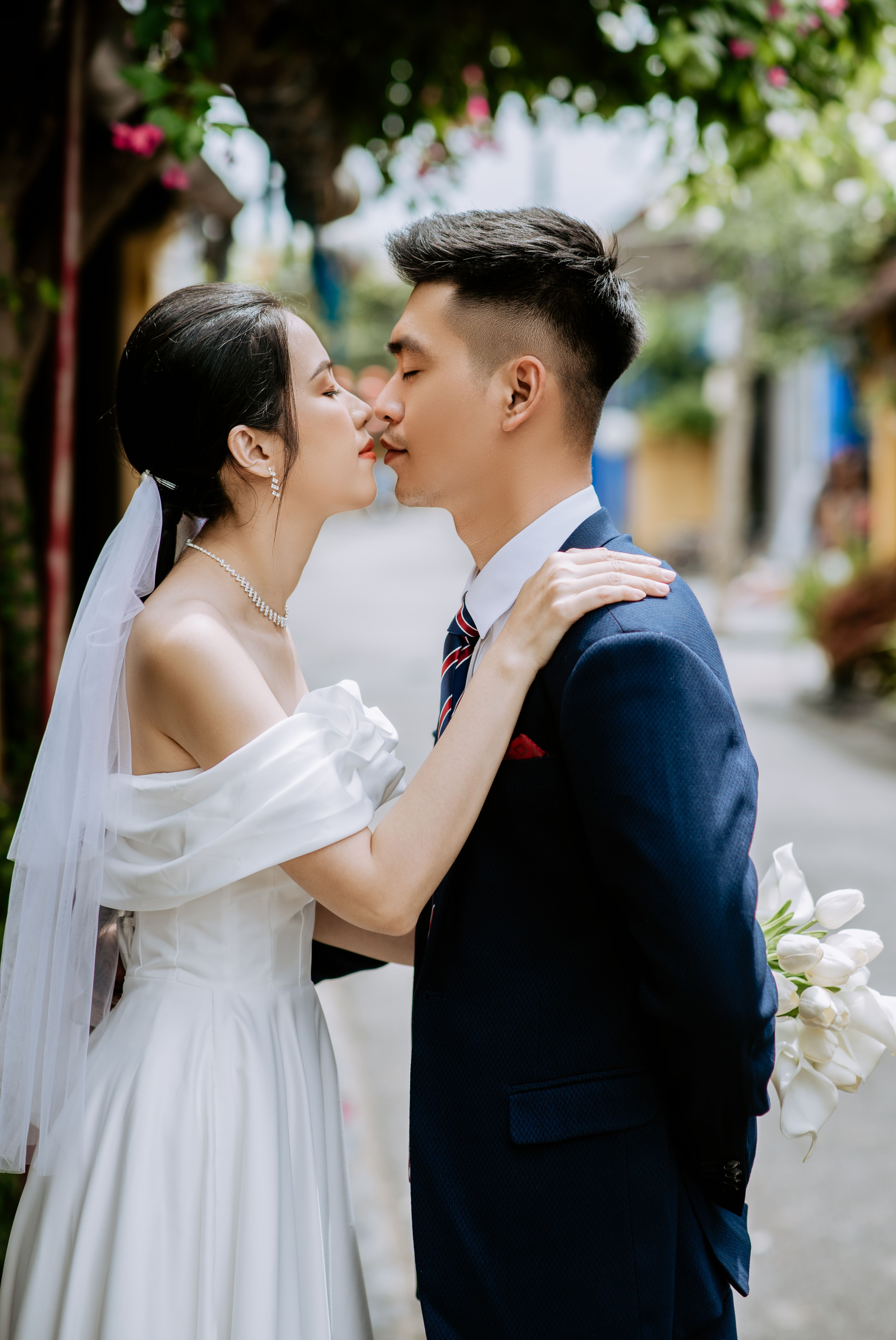 Man in Black Suit Kissing Woman in White Wedding Dress · Free Stock Photo