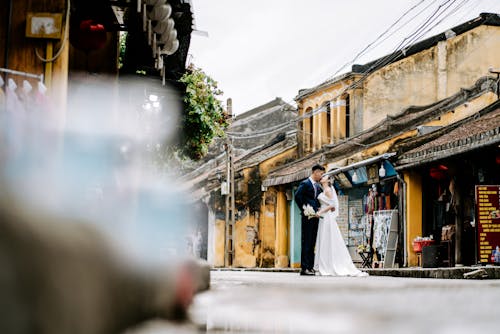 Bride and Groom Kissing on the Street