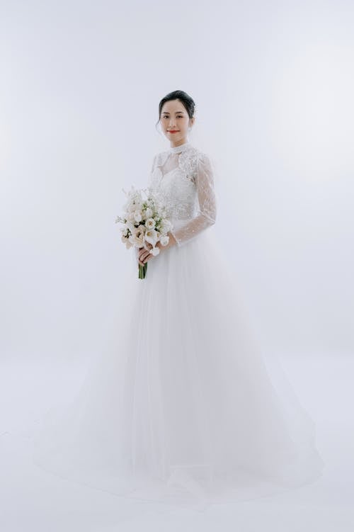 Bride Holding Bouquet of Flowers