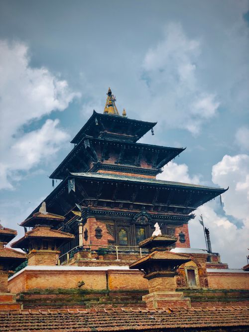 Free Explore the ancient architectural beauty of an Eastern temple under vibrant skies, captivating and spiritual. Stock Photo