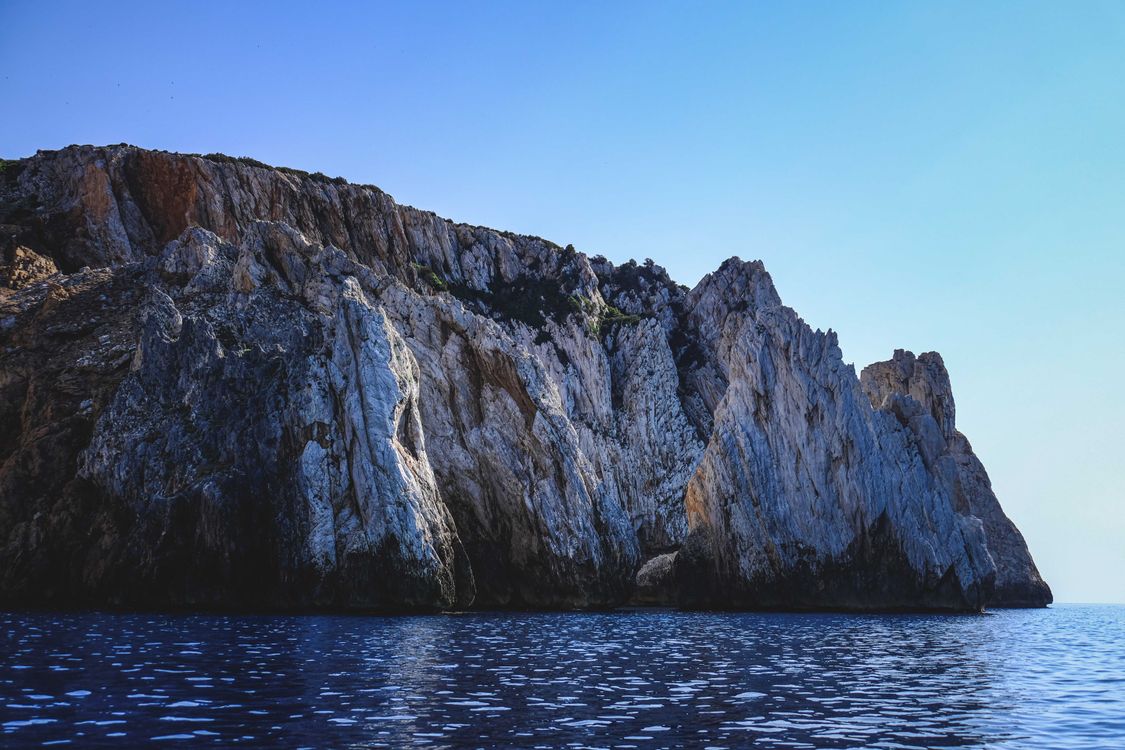 Gray Rock Formation on Sea · Free Stock Photo