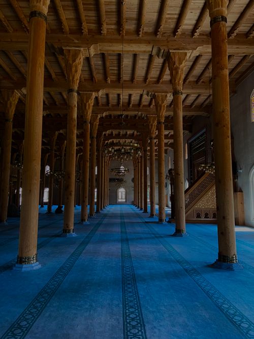 Free Serene interior showcasing majestic wooden columns in a beautifully designed temple. Stock Photo