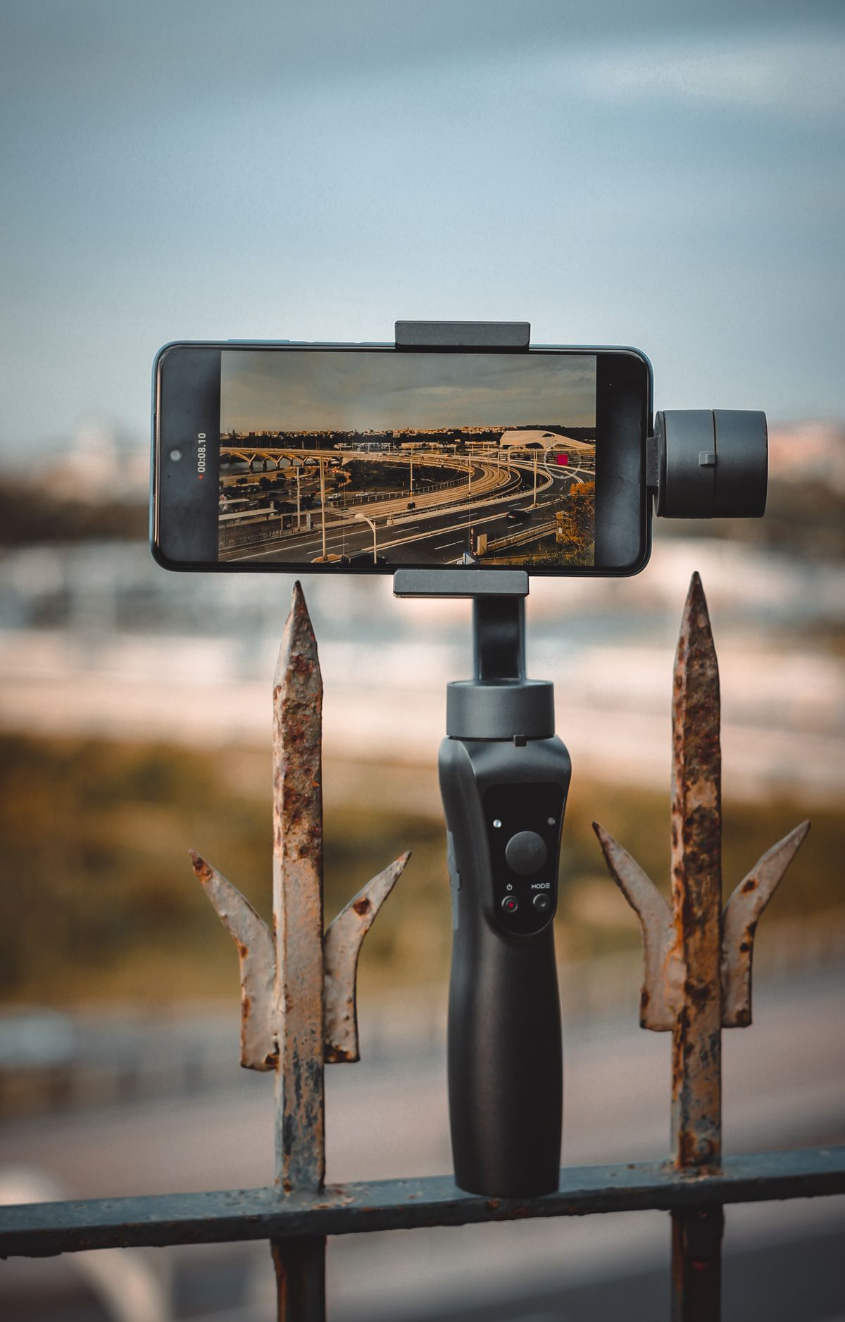 Smartphone on a stabilizer filming a job site
