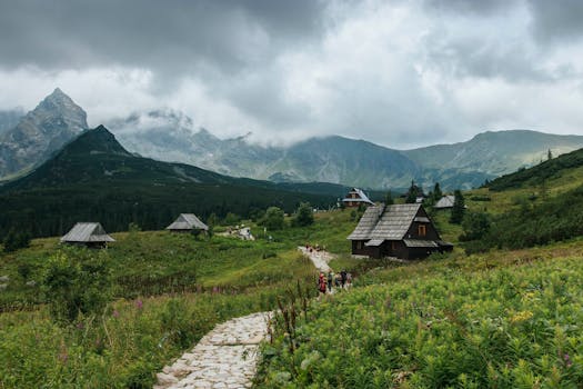 Charming wooden houses in the Tatra Mountains near Zakopane, Poland on a cloudy day.