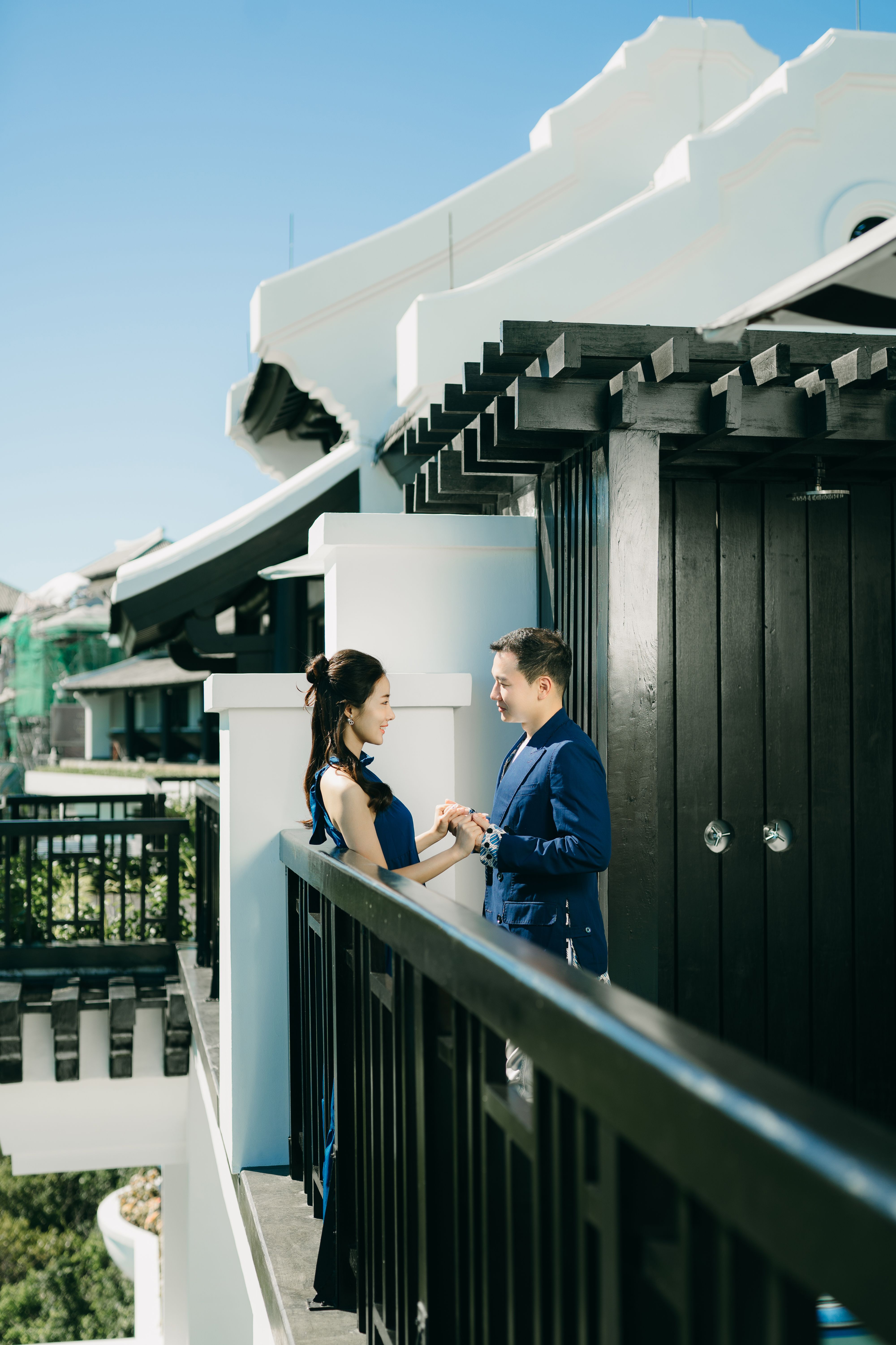 A Couple Holding Hands While Standing Near the Metal Railing · Free ...