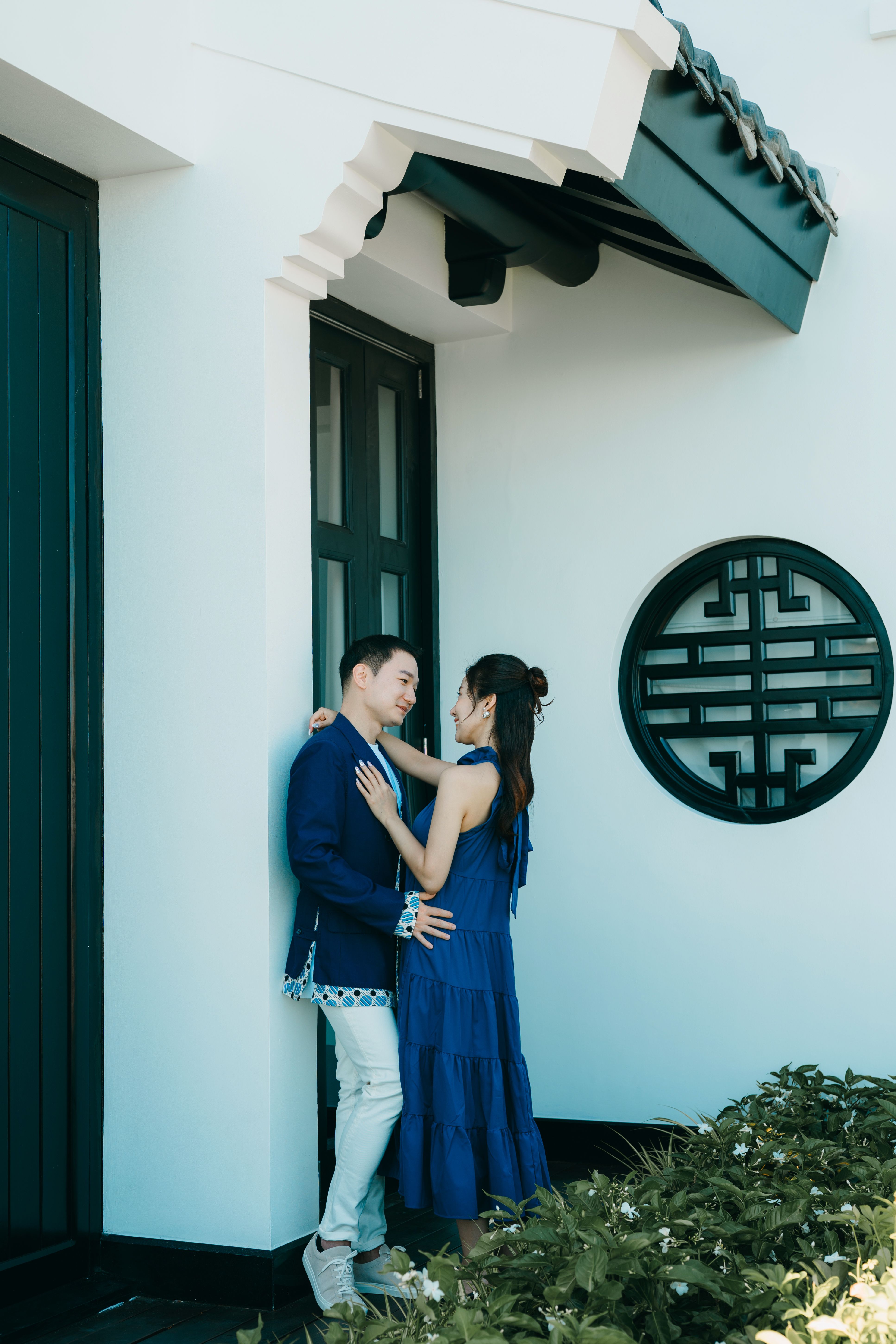 Young Couple Hugging in Front of a Building · Free Stock Photo