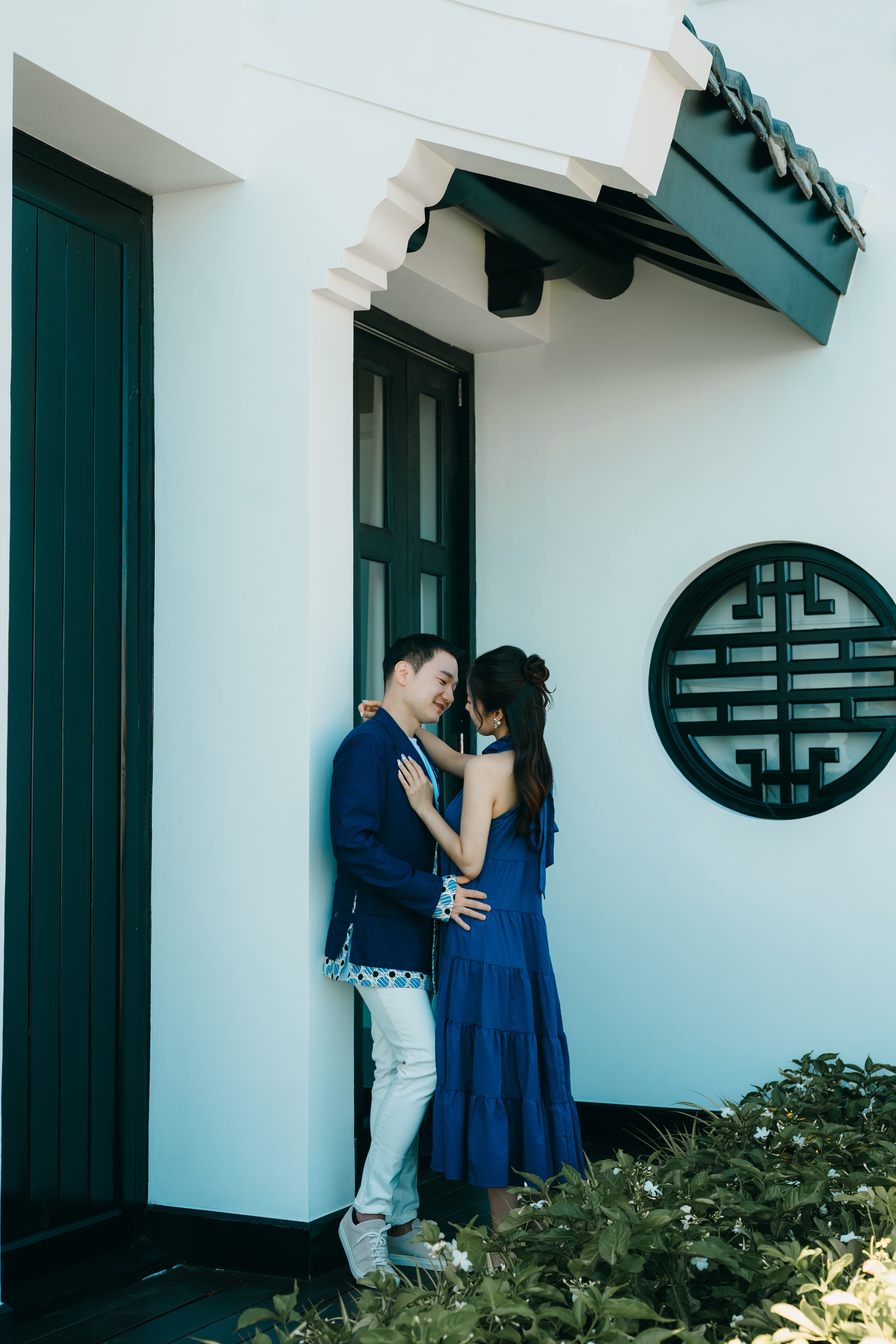 Young Couple Hugging in Front of a Building · Free Stock Photo
