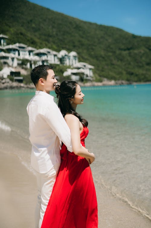 A Couple Hugging on the Beach