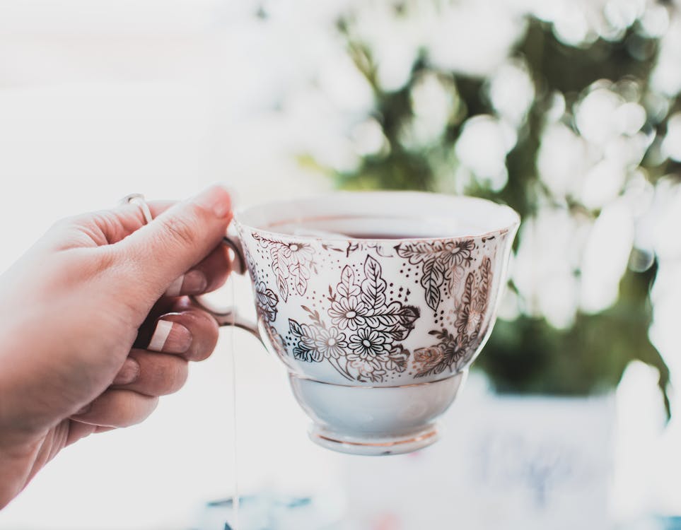 Free Person Holding Teacup Stock Photo