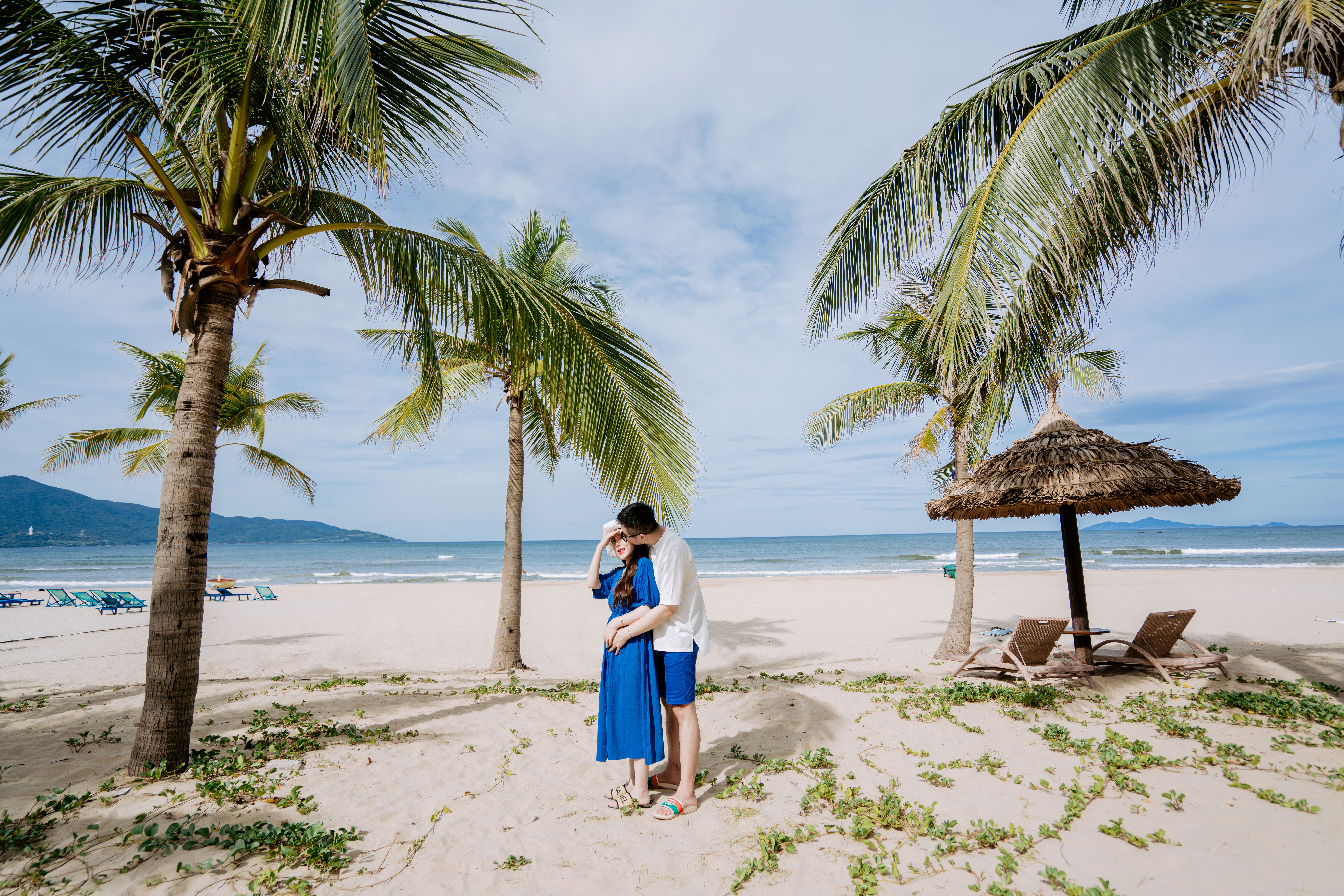 Romantic beach moment under palm trees