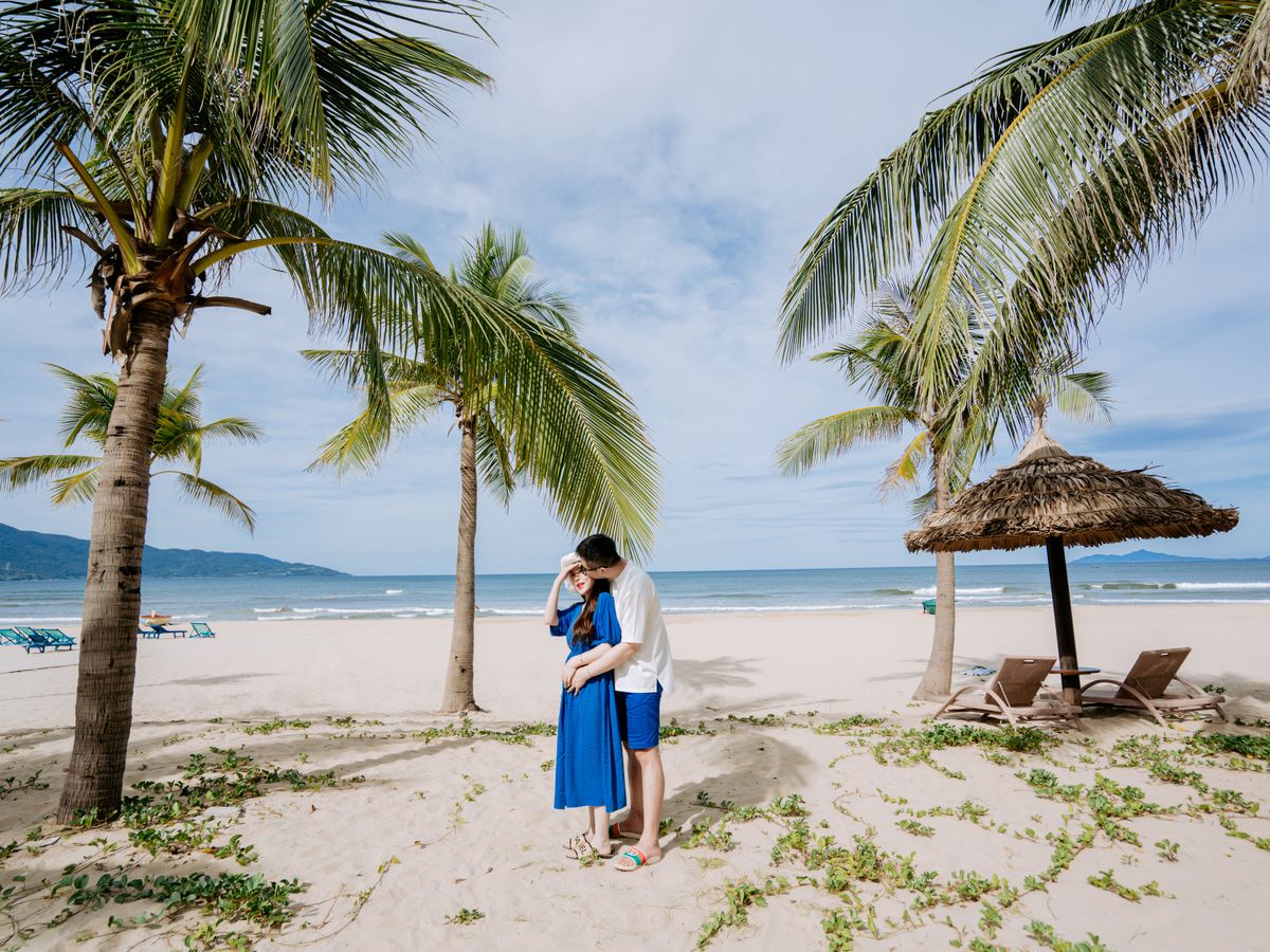 Romantic beach moment under palm trees