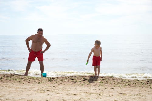 Free Photo of a Man and His Son at the Beach Stock Photo