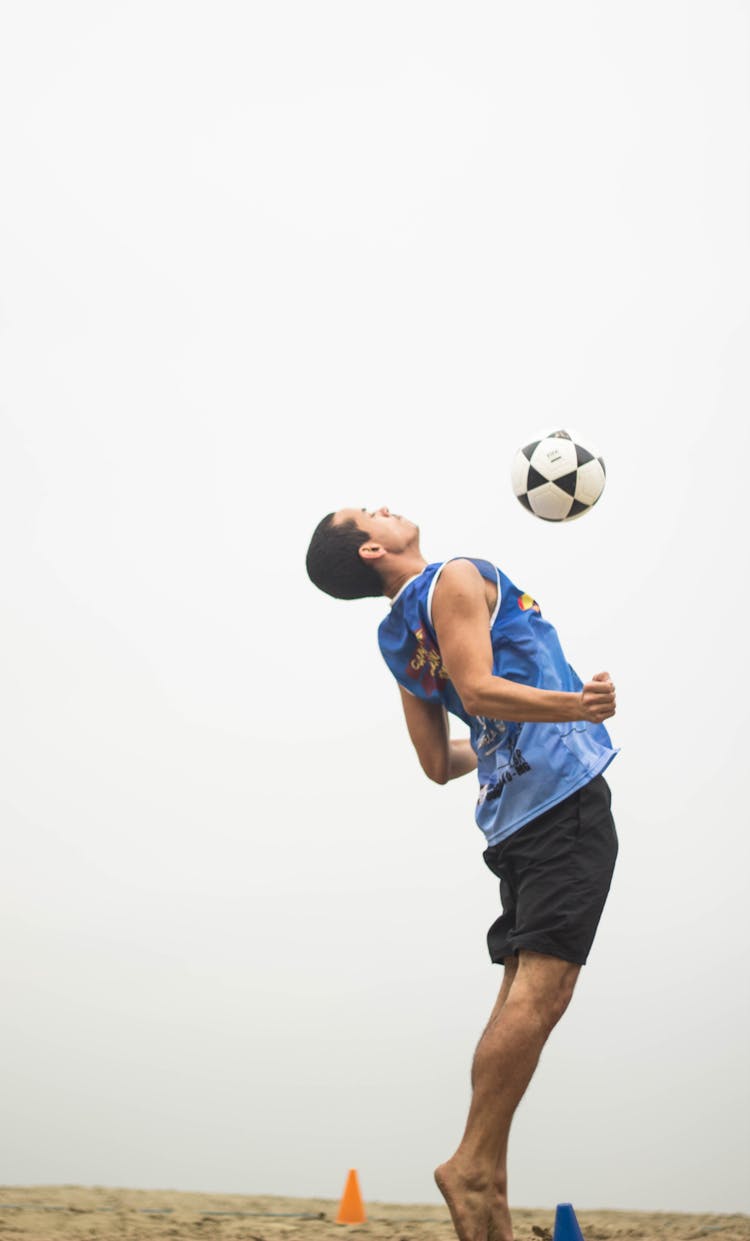 Man Playing Soccer Ball