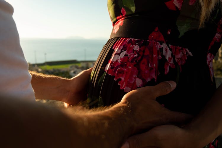 Man Hands Touching Woman Back