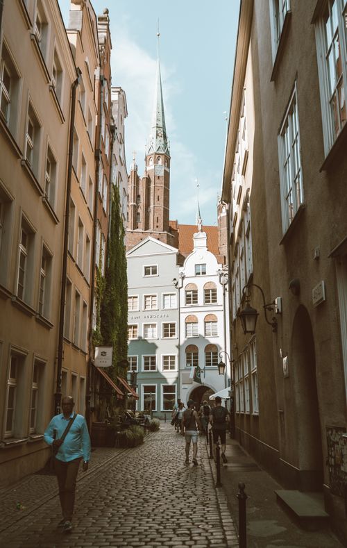 Free Explore the narrow cobblestone streets and stunning architecture of Gdansk's historic Old Town. Stock Photo