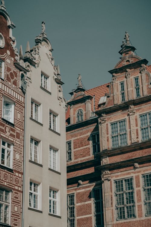 Free Ornate historical building facades under a clear sky in a European old town. Stock Photo
